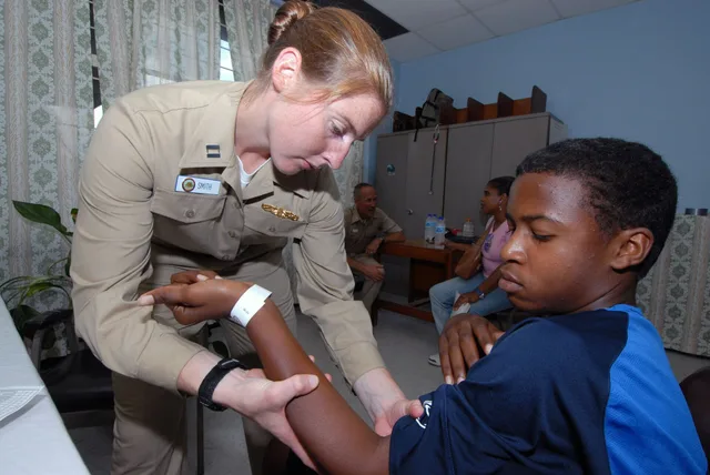 ARIMA, Trinidad and Tobago (Sept. 17, 2007) - Lt. Gwen Smith, attached to Military Sealift Command hospital ship USNS Comfort (T-AH 20), performs physical therapy for Marcus Pryce at the Arima Health Facility. Comfort is on a four-month humanitarian deployment to Latin America and the Caribbean prov. Physical Therapy Referral Program: Referrers and Patients