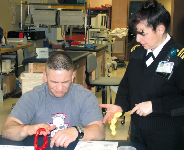 Bethesda, Md. (Apr. 3, 2003) -- In the Occupational Therapy (OT) outpatient clinic, Marine Sgt. Byron Bell builds up his grip strength by performing specialized exercises with putty. Lt. Cdr. Linda Coniglio, Medical Service Corp, OT Service Chief, assists Sgt. Bell through his exercises. U.S. Navy p. Physical Therapy Cancellation Policy Template: 5 Steps