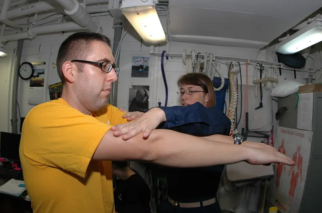 INDIAN OCEAN (Oct. 3, 2009) Gunner's Mate 2nd Class Patrick Cornwell undergoes an exam by Lt. Cristi Zohlen to document his shoulder pain in the physical therapy clinic aboard the aircraft carrier USS Nimitz (CVN 68). The Nimitz Carrier Strike Group is on a routine deployment to the U.S. 5th Fleet a. A training checklist for physical therapy staff without the jargon