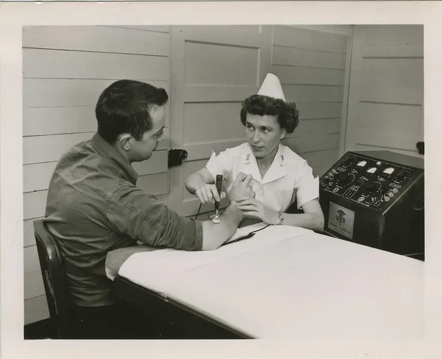 Physical therapist massaging arm (SC 497678), National Museum of Health and Medicine Description: "Captain Strobel, Physical Therapist, massages the muscle in the arm of patient Private Morrison in the Physical Therapy Ward, Building C14, US Army Hospital, Fort Chaffee. The machine is called an elec. 8 points on choosing physical therapy software